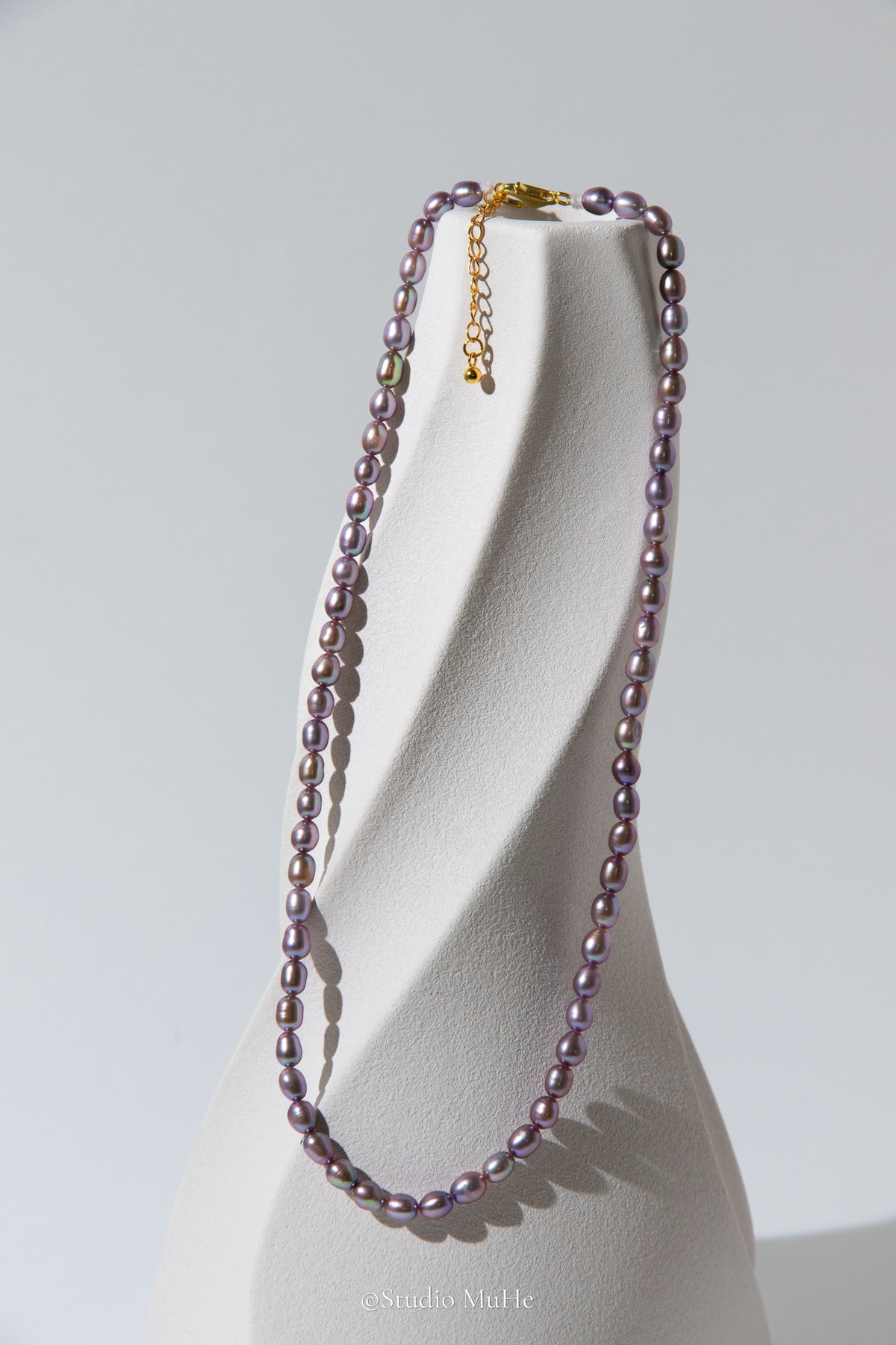 entry level metallic purple and green colored rice pearls necklace