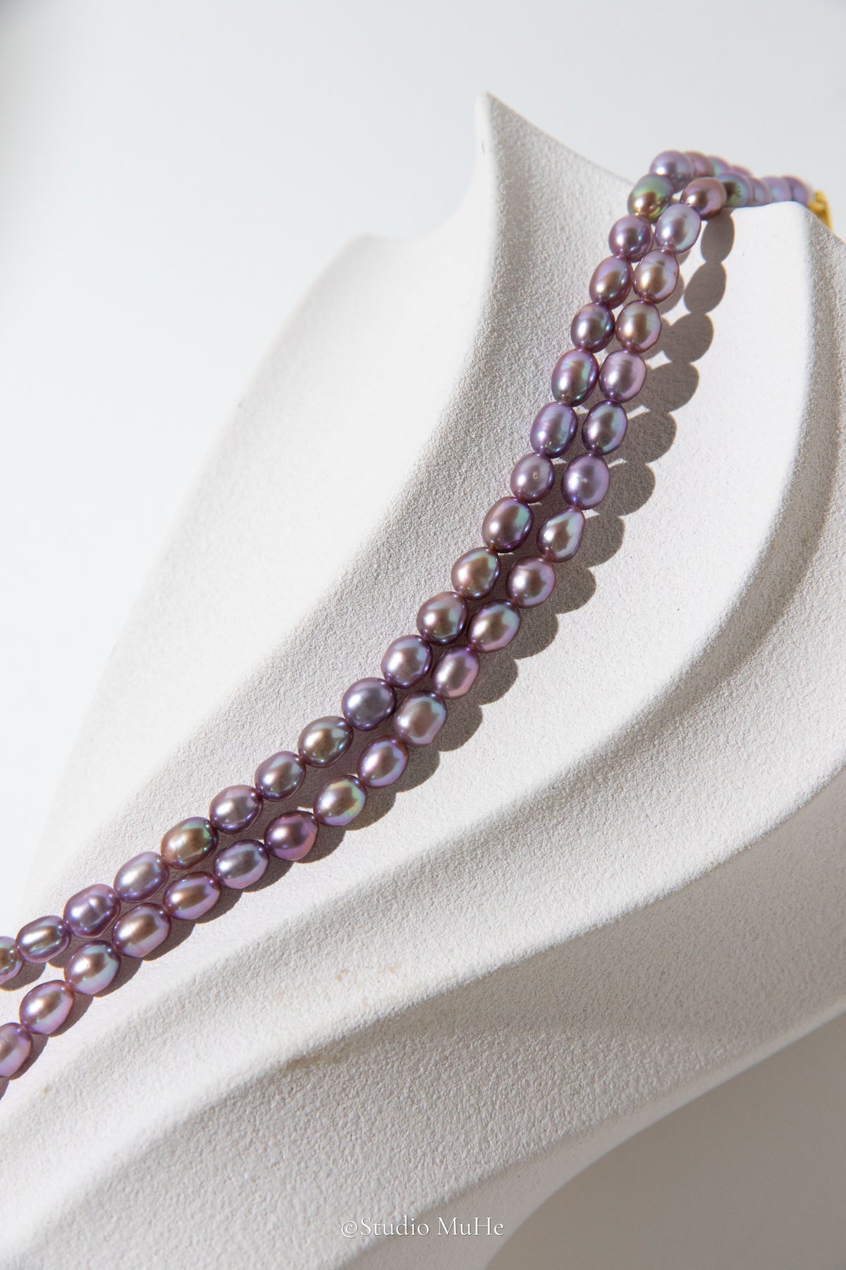 entry level metallic purple and green colored rice pearls necklace