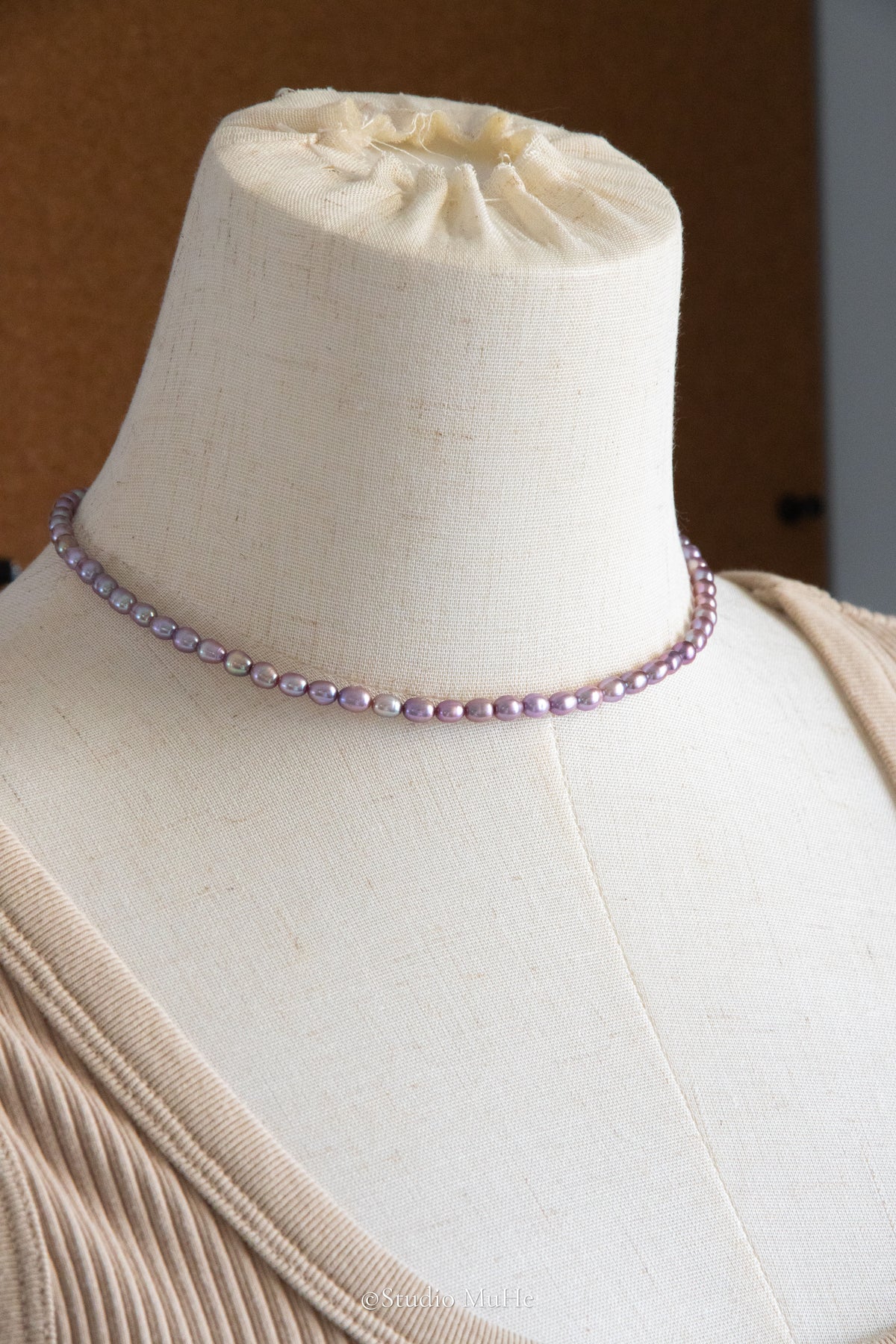 entry level metallic purple and green colored rice pearls necklace