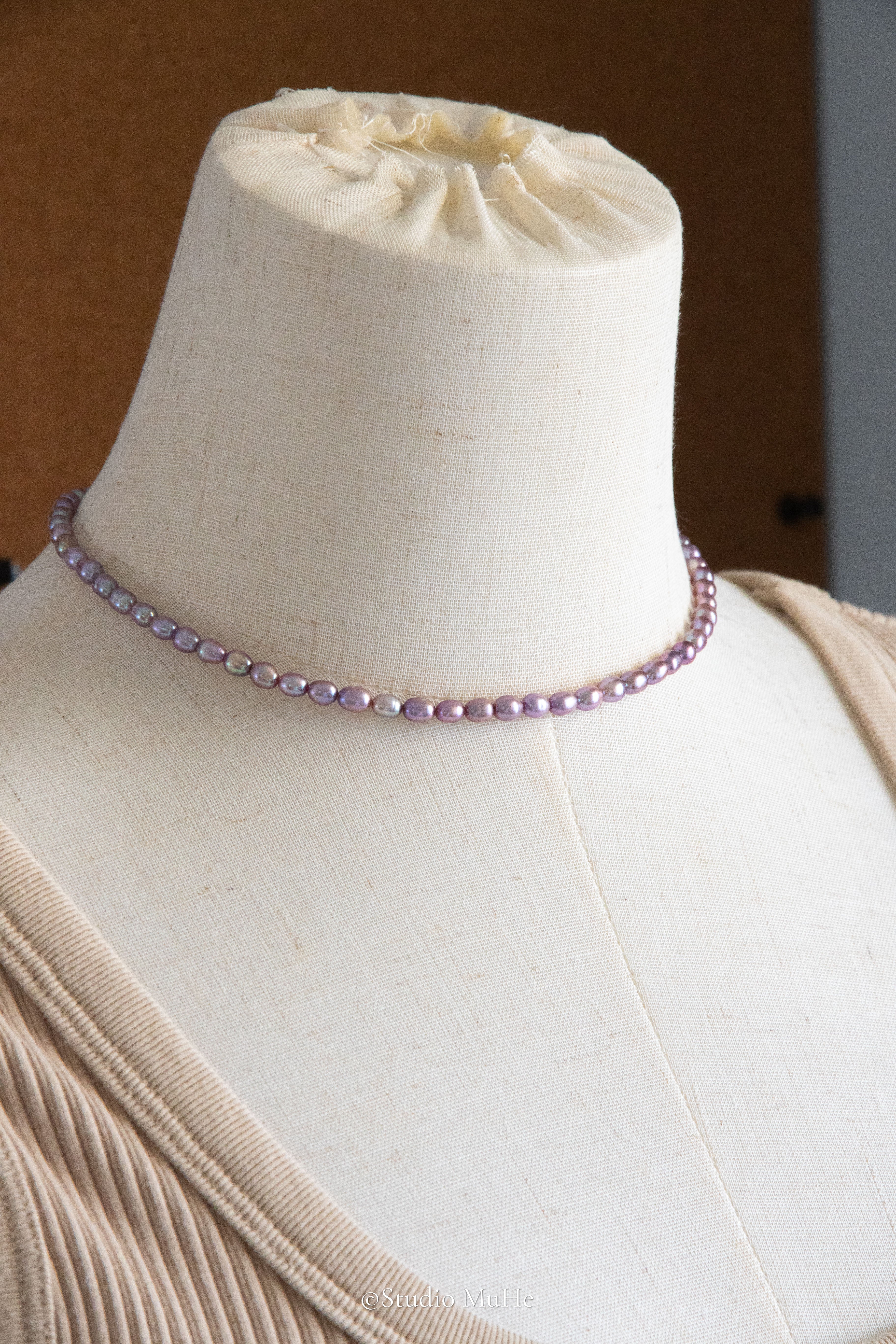 entry level metallic purple and green colored rice pearls necklace