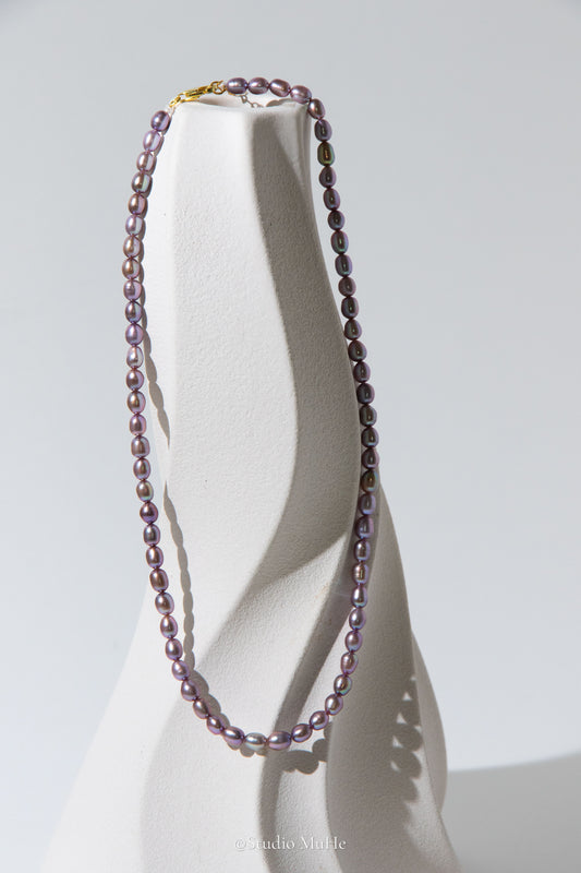 entry level metallic purple and green colored rice pearls necklace