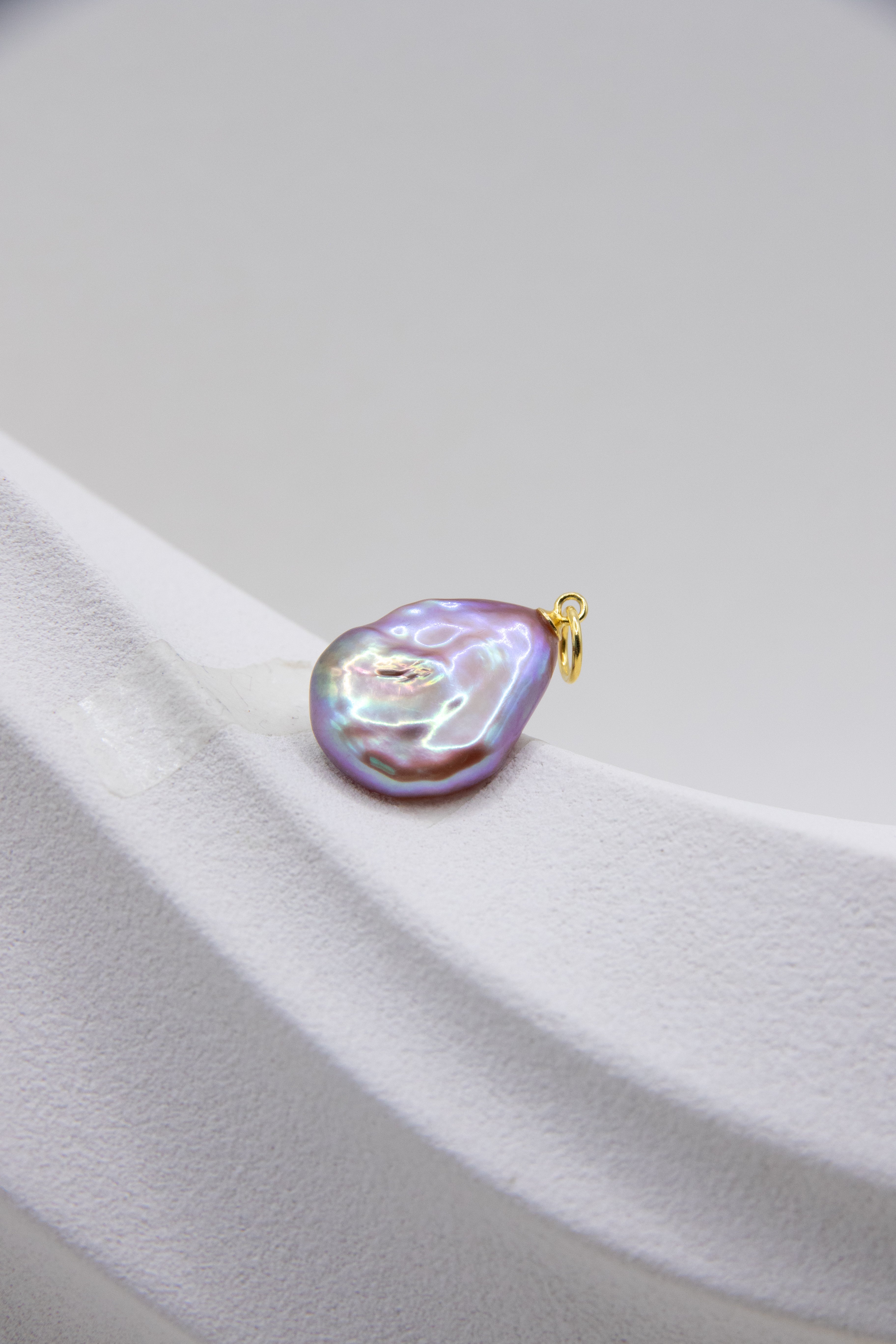 Flat purple drop pearl pendant